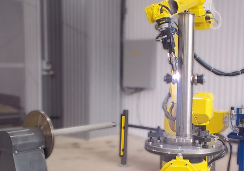 Robot for welding oil samplers