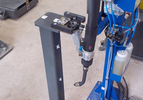 Robot for welding oil samplers